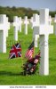 stock-photo-british-and-american-flags-and-flowery-wreath-by-grave-cross-in-the-american-war-cem.jpg