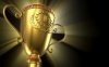 14413124-award-winning-and-championship-concept-golden-glowing-trophy-cup-on-black-background.jpg